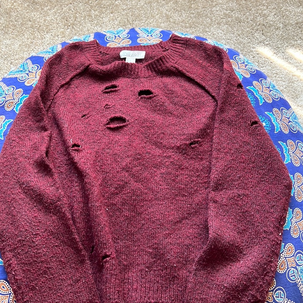 Burgundy sweater.